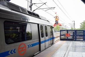 Delhi Metro train arriving at Jhandewalan metro station in New Delhi, India, Asia, Public Metro departing from Jhandewalan station in which more than 17 lakhs passengers travel from Delhi Metro photo