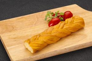 Caucasian traditional pigtail cheese served tomatoes photo