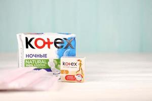 KHARKIV, UKRAINE - DECEMBER 16, 2021 Kotex production with logo. Kotex is a brand of feminine hygiene products, includes maxi, thin and ultra thin pads. photo