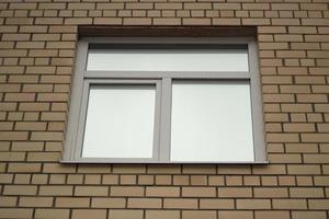 Window in building. Brick wall. Architecture details. photo