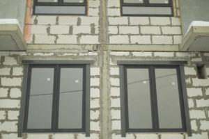 Windows in building. Unfinished house. photo