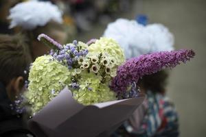 Festive bouquet. Flowers in child. Teaching brings flowers to teacher. photo