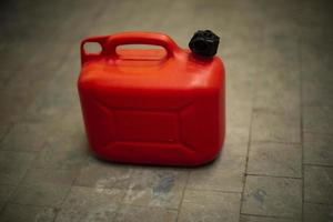 Red canister of fuel. Oil tank. photo