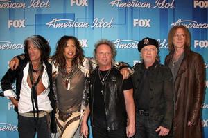 LOS ANGELES  MAY 23 - Aerosmith   L R  Musicians Joe Perry, Steven Tyler, Joey Kramer, Brad Whitford, and Tom Hamilton in the Press Room of the American Idol 2012 Finale at Nokia Theater on May 23, 2012 in Los Angeles, CA photo