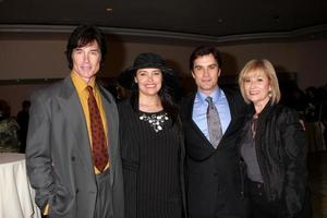 LOS ANGELES, FEB 20 - Ronn Moss, Devin DeVasquez Moss, Rick Hearst and mom arrives at the 2011 Catholics in Media Associates Award Brunch at Beverly HIlls Hotel on February 20, 2011 in Beverly Hills, CA photo