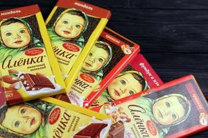 KHARKIV, UKRAINE - JANUARY 27, 2021 Alyonka chocolate square bars - product from Red October chocolate factory. Old russian traditional chocolate photo