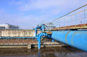 Industrial space with lots of pipes and communications photo