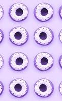 Many small plastic donuts lies on a pastel colorful background. Flat lay minimal pattern. Top view photo