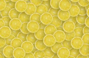 Pattern of yellow lemon citrus slices. Citrus flat lay photo