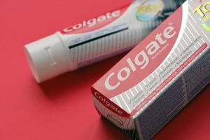 TERNOPIL, UKRAINE - JUNE 23, 2022 Colgate toothpaste, a brand of oral hygiene products manufactured by American consumer-goods company Colgate-Palmolive photo