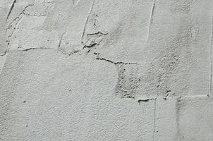 The texture of the wall, covered with gray foam polystyrene plates, which are smeared with a reinforcing mixture. Stage of wall insulation photo