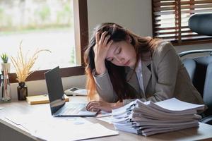 Concept Burnout Syndrome. Business Woman feels uncomfortable working. Which is caused by stress, accumulated from unsuccessful work And less resting body. Consult a specialist psychiatrist. photo