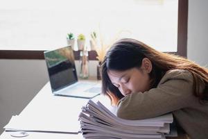 Concept Burnout Syndrome. Business Woman feels uncomfortable working. Which is caused by stress, accumulated from unsuccessful work And less resting body. Consult a specialist psychiatrist. photo