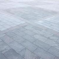 Fragment of the square paved of a large granite tiles photo