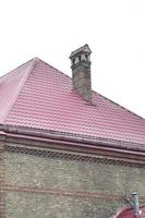 Fragment of a metal roof of the restored old multi-storey building in Lviv, Ukraine photo