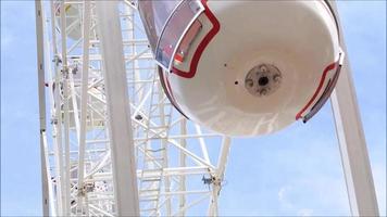 White Ferris wheel in close-up when it's moving around. video