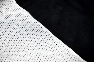 Close up of white polyester nylon sportswear shorts to created a textured background photo