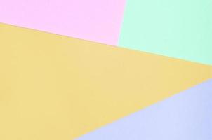 Texture background of fashion pastel colors. Pink, violet, orange and blue geometric pattern papers. photo