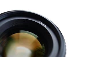 Fragment of a portrait lens for a modern SLR camera. A photograph of a wide-aperture lens with a focal length of 50mm isolated on white photo