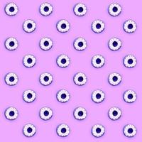 Many small plastic donuts lies on a pastel colorful background. Flat lay minimal pattern. Top view photo
