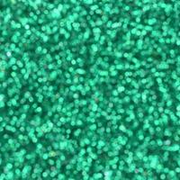 Blurred green decorative sequins. Background image with shiny bokeh lights from small elements photo