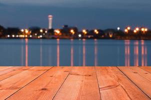 perspective wooden desk by lake photo