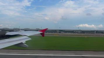 CHANGI, SINGAPORE NOVEMBER 22, 2018  - Changi Airport view from braking airplane AirAsia after landing. video