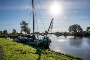 boats on the river in the sun photo