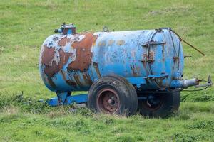 old cart in a field photo