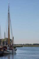 boats on the river in the sun photo