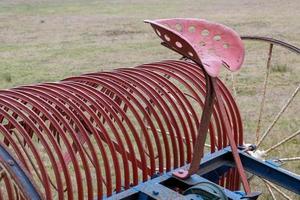 part of a tractor on a field photo