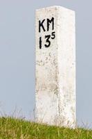 concrete pole with kilometer indication photo