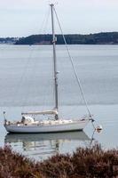 Arne, Dorset, UK - September 20. View of a yacht moored near Arne in Dorset on September 20, 2022 photo