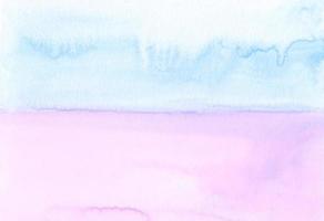Watercolor pastel blue and pink background texture. Stains on paper, hand painted. Artistic wallpaper photo