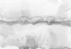 Abstract light gray watercolor background. Minimalist black and white landscape. Stains on paper photo
