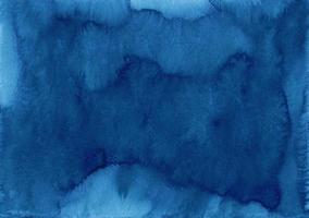 Watercolor dark blue background texture. Navy blue stains on paper, hand painted. photo