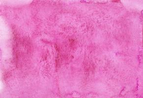textura de fondo de acuarela rosa abstracta, pintada a mano. manchas en papel foto