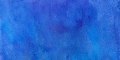 Watercolor deep blue background texture. Dark blue stains on paper, hand painted. Watercolour banner. photo