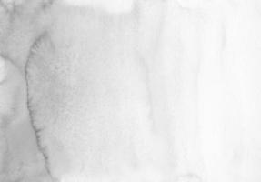 textura de fondo de acuarela degradada gris tranquila abstracta, pintada a mano. fondo artístico en blanco y negro, manchas en papel. papel tapiz de pintura monocromática aquarelle. foto