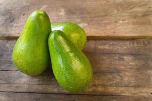 avocado on wood background photo