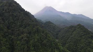 Aerial view of Merapi Mountain in indonesia with tropical forest around it video