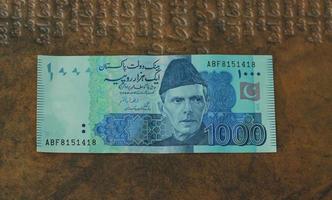 Money of Pakistan. Pakistani rupee bills. PKR banknotes. 500 1000 5000 rupees. Business, finance, news background. pakistani currency notes. photo