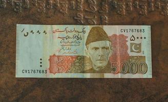 Money of Pakistan. Pakistani rupee bills. PKR banknotes. 500 1000 5000 rupees. Business, finance, news background. pakistani currency notes. photo