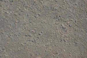Texture of dirty and gloomy gray asphalt