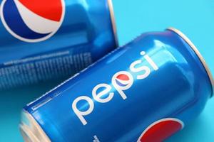 TERNOPIL, UKRAINE - MAY 28, 2022 Cold Pepsi drink can. Pepsi is a carbonated soft drink produced by PepsiCo photo