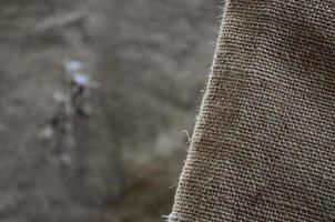 The texture of a very old brown sack cloth. Retro texture with canvas material. Background image with copy space photo