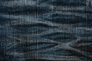 Detailed texture of dark denim cloth photo