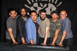 LOS ANGELES, JUN 18 -  Linkin Park, Mike Shinoda, Rob Bourdon, Joe Hahn, Brad Delson, Dave Farrell, Chester Bennington at the Linkin Park Rockwalk Inducting Ceremony at the Guitar Center on June 18, 2014 in Los Angeles, CA photo