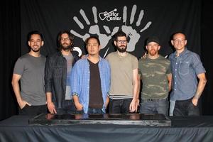 LOS ANGELES, JUN 18 -  Linkin Park, Mike Shinoda, Rob Bourdon, Joe Hahn, Brad Delson, Dave Farrell, Chester Bennington at the Linkin Park Rockwalk Inducting Ceremony at the Guitar Center on June 18, 2014 in Los Angeles, CA photo