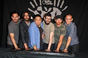 LOS ANGELES, JUN 18 -  Linkin Park, Mike Shinoda, Rob Bourdon, Joe Hahn, Brad Delson, Dave Farrell, Chester Bennington at the Linkin Park Rockwalk Inducting Ceremony at the Guitar Center on June 18, 2014 in Los Angeles, CA photo